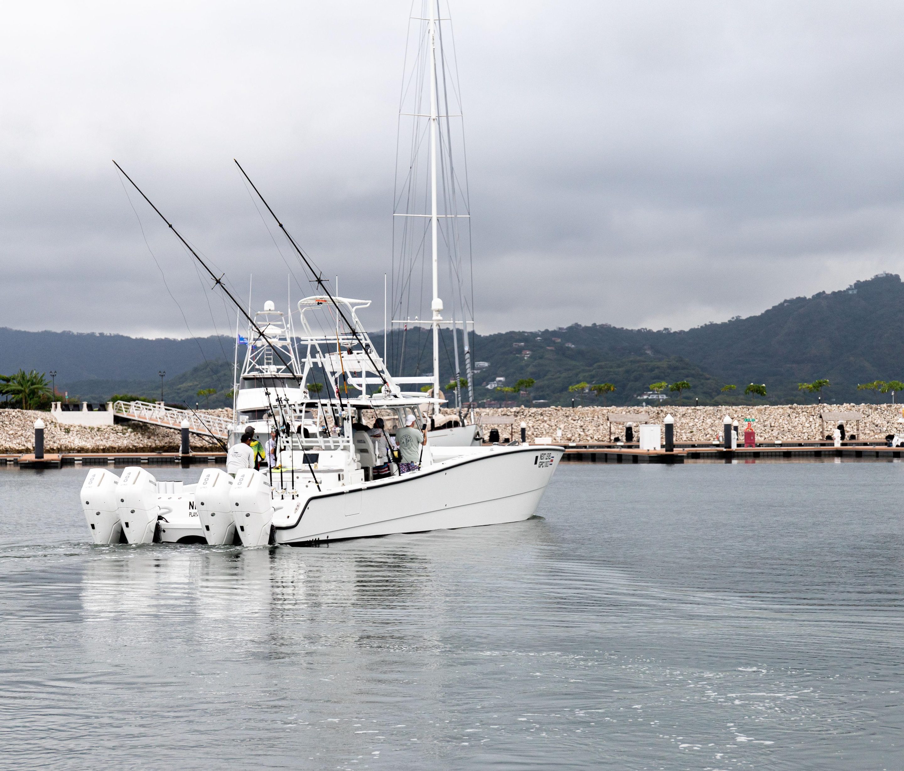 Tamarindo fishing boat Next Level leaving marina with crew preparing for deep sea fishing trip
