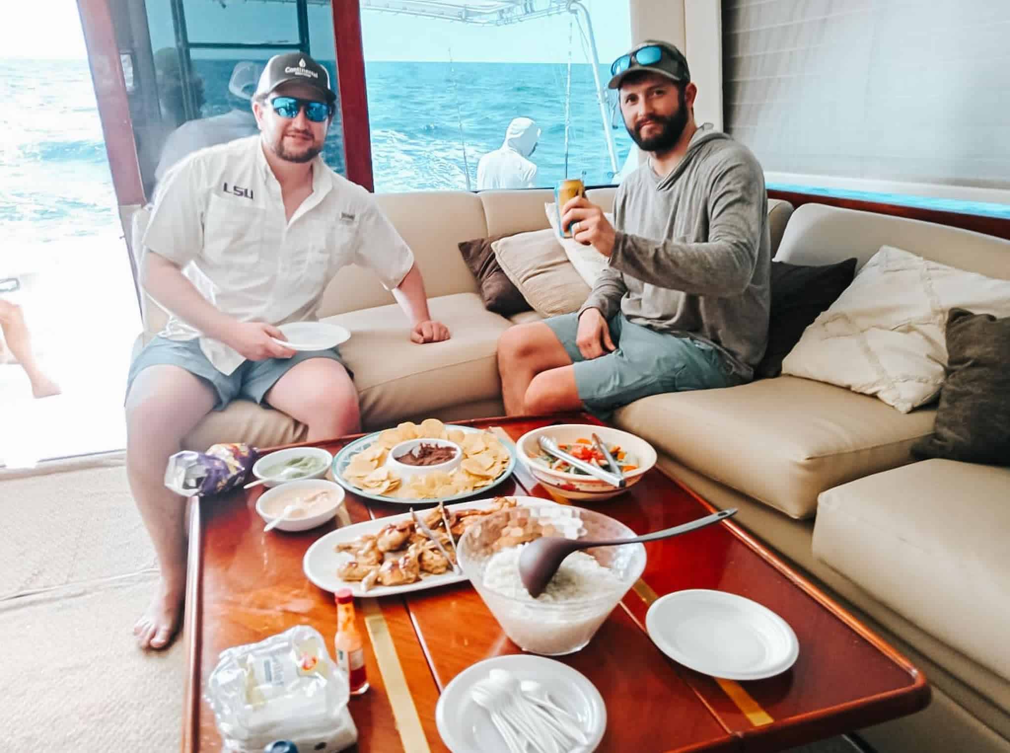 Fishermen on mojito fishing boat having lunch